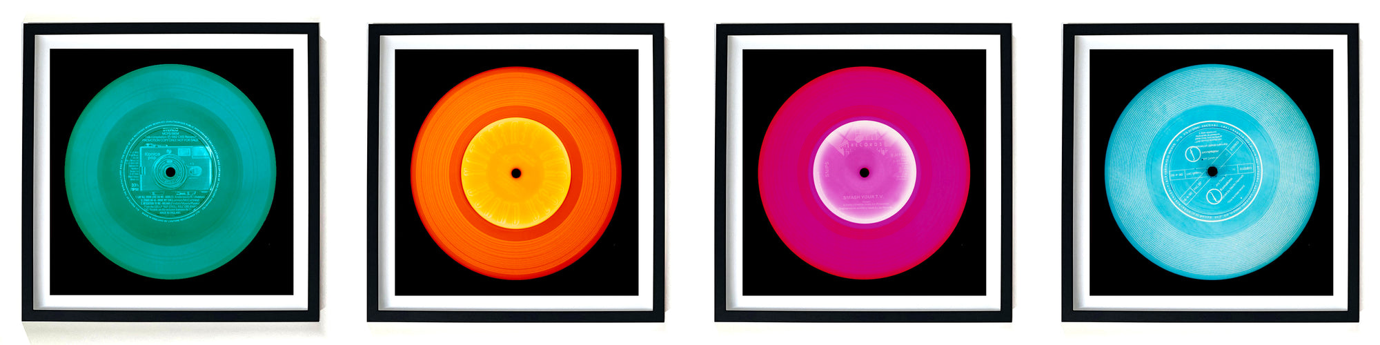 Photographs by Heidler and Heeps. A line of 4 photographs of vinyls in striking colours, with black frames. 