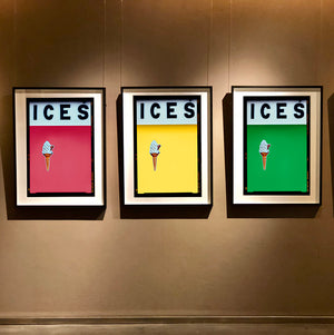 Set of three photographs by Richard Heeps.  Three identical photographs (apart from the block colour), at the top black letters spell out ICES and below is depicted a 99 icecream cone sitting left of centre set against, in turn, a coral, sherbert yellow and green coloured background.  