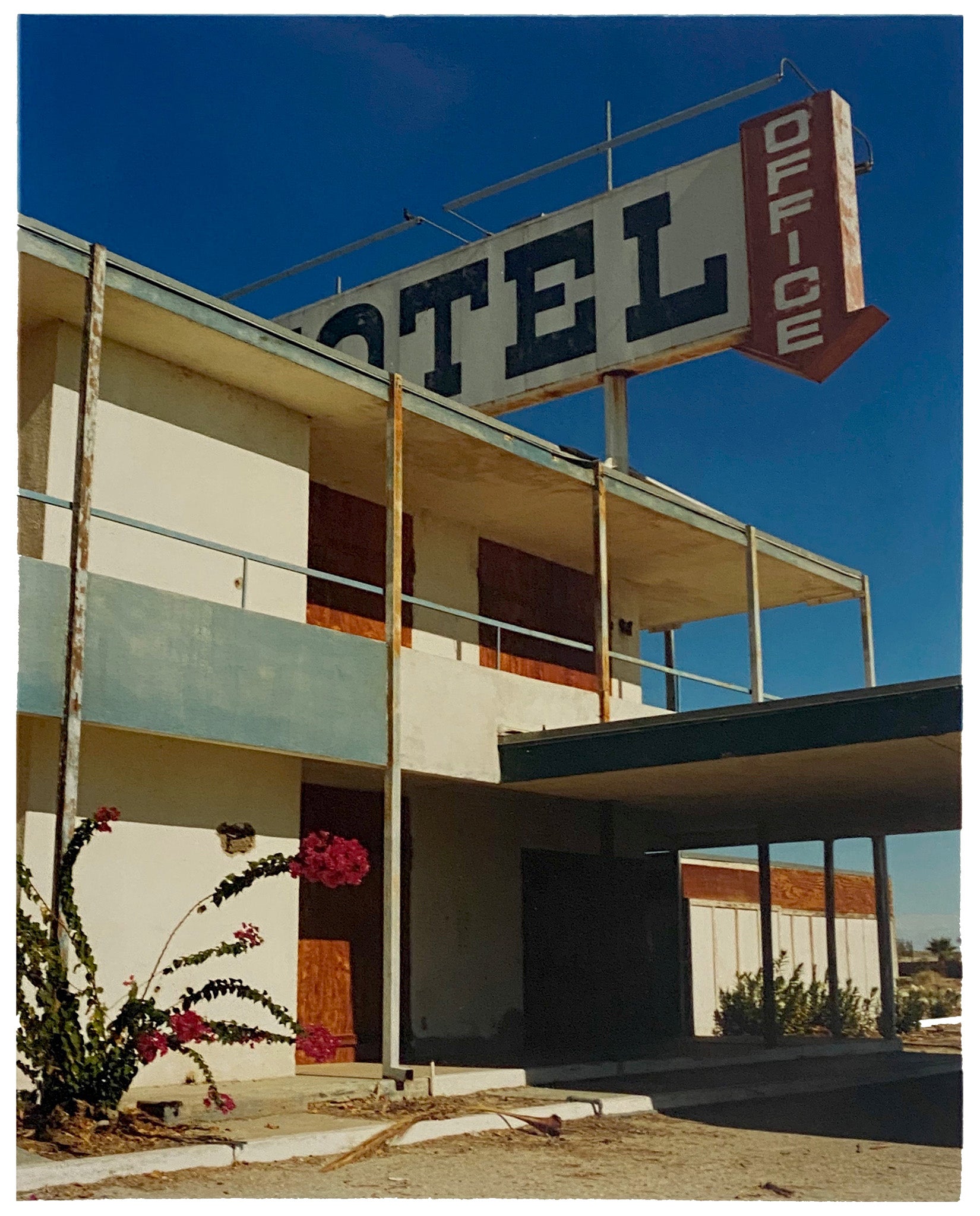 North Shore Motel Office II from Richard Heeps Salton Sea series. Blue skies over this Californian classic mid-century modern Americana Motel exterior. Captured by Richard Heeps in the Salton Sea in 2003 but only executed in his darkroom for the first time in Spring 2020.