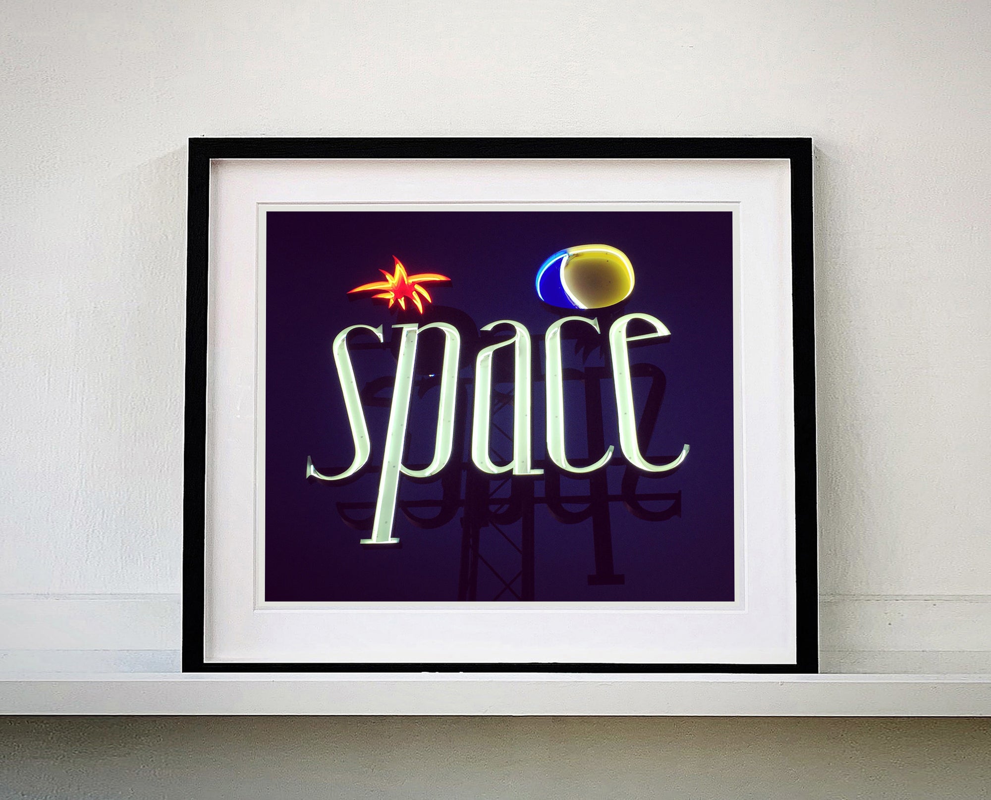 'Space', features neon lettering against an inky blue sky. The subject is a roadside sign taken in Ibiza during the final year of the iconic super club 'Space'. 