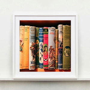 White frame photograph of vintage book spines by Richard Heeps.
