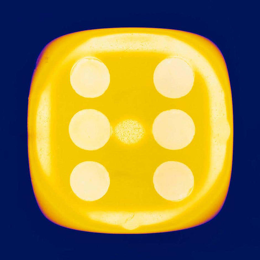 Richard Heeps Yellow Dice showing 6 on a blue background