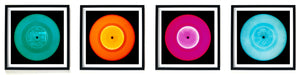 Photographs by Heidler and Heeps. A line of 4 photographs of vinyls in striking colours, with black frames. 