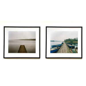 Two framed landscape photographs displayed side by side on a white wall. Norfolk Broads waterscape prints by Richard Heeps.
