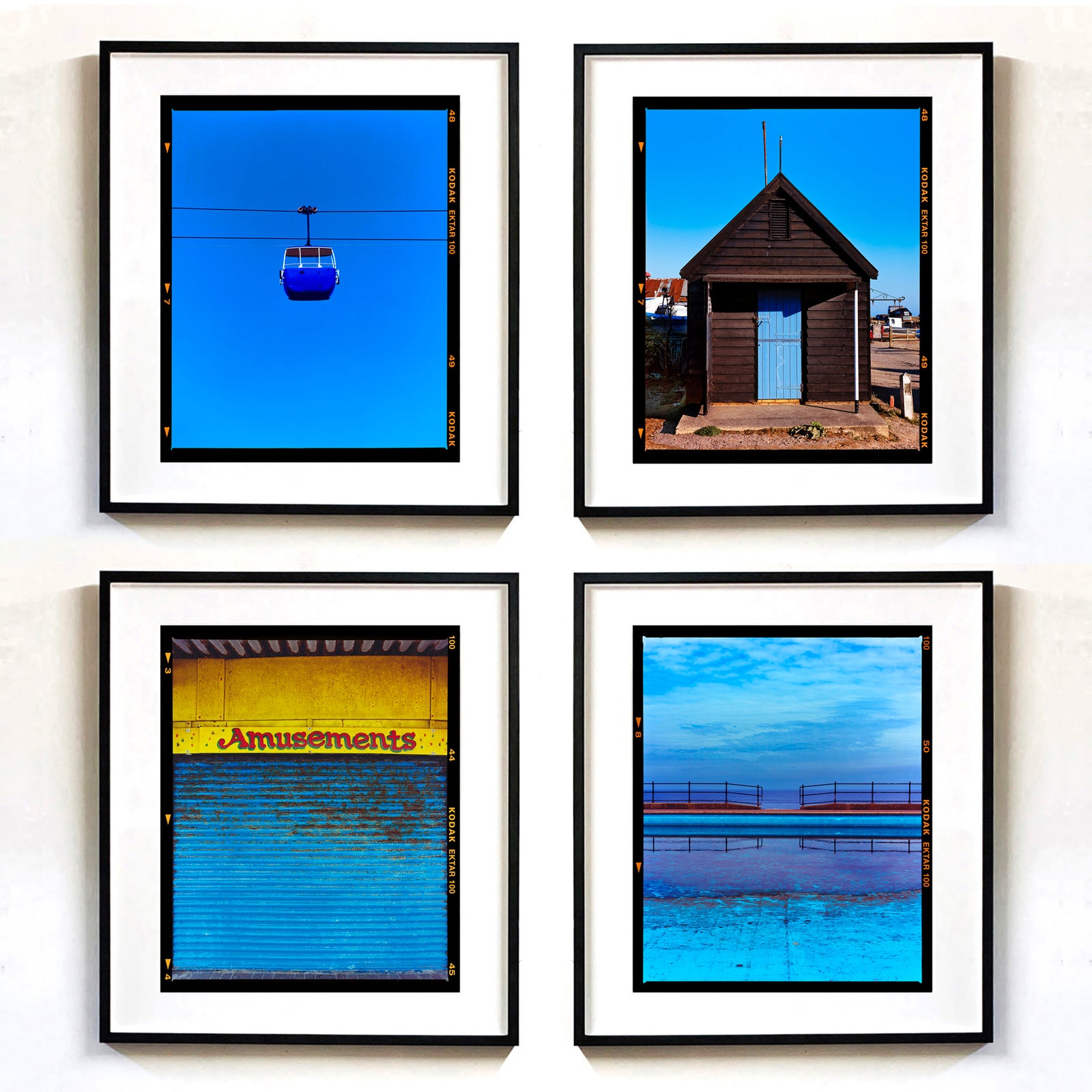 Blue British Seaside artwork collection by Richard Heeps framed in black