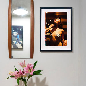 Delilah backstage burlesque photography by Richard Heeps framed in black in situ.