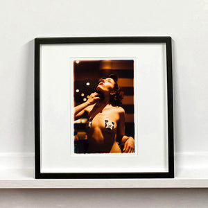 Delilah burlesque backstage photography by RIchard Heeps mounted square framed in black.