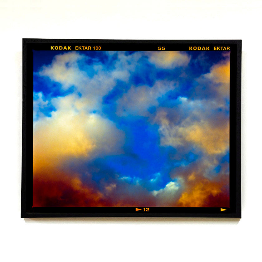Recently sold artwork Fenland Clouds photograph by Richard Heeps framed in black.