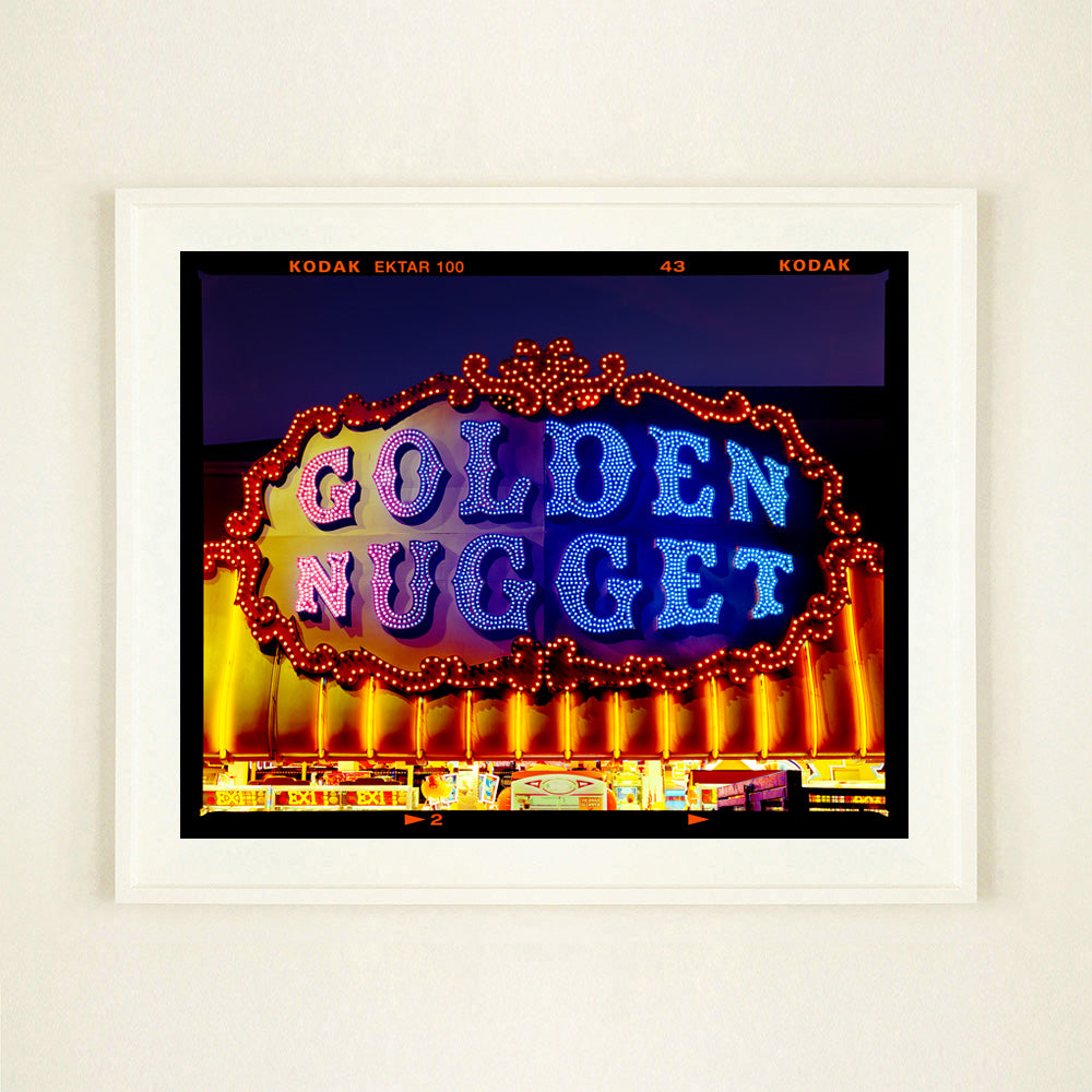 Golden Nugget Norfolk British seaside arcade sign photograph by Richard Heeps in a large white frame.