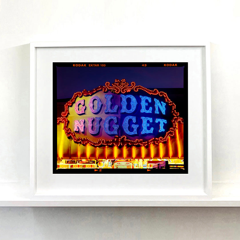 Golden Nugget Norfolk British seaside arcade sign photograph in a white frame on a shelf by Richard Heeps