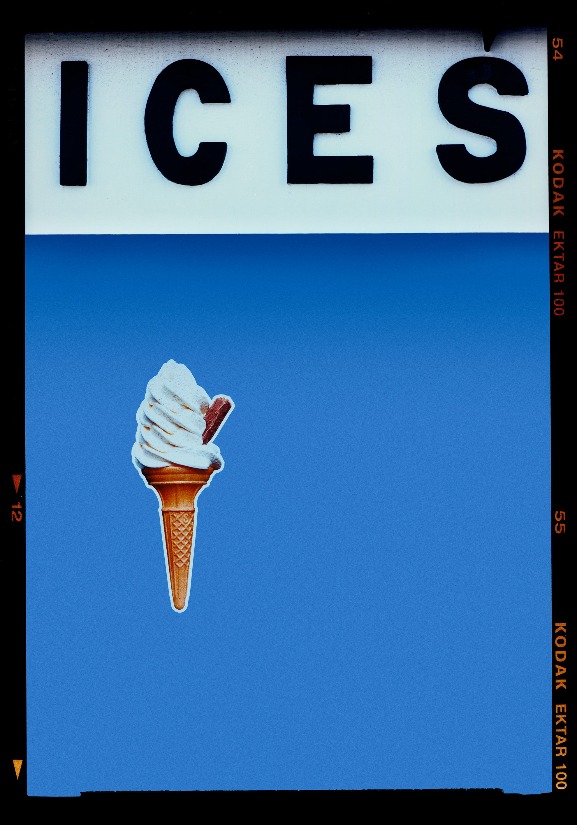 Photograph by Richard Heeps.  At the top black letters spell out ICES and below is depicted a 99 icecream cone sitting left of centre against a Baby Blue coloured background.  