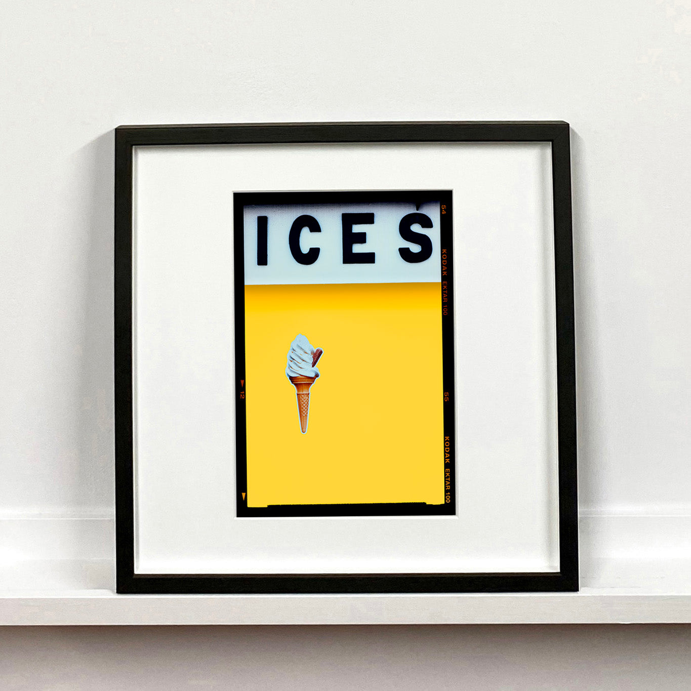 Ices honey yellow pop art typography colour photography print by Richard Heeps mounted square framed in black.