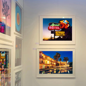 La Concha Motel Pool Las Vegas American architecture colour photograph by Richard Heeps framed in white on the wall.