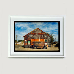 Model T and Garage American road trip colour Kodak Film photograph by Richard Heeps small framed in white