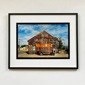 Model T and Garage Kodak Film photograph framed in black.