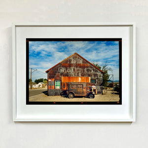Model T and Garage Kodak Film photograph framed in white.