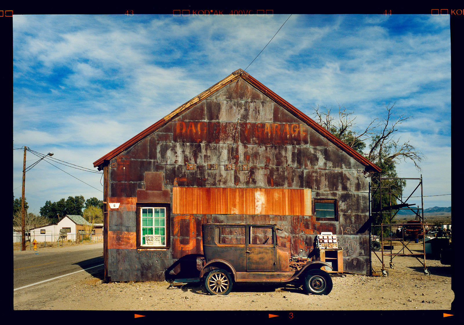 Model T and Garage American road trip colour Kodak Film photograph by Richard Heeps
