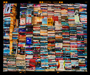 Mother India Delhi street photography multicolour book stack photograph by Richard Heeps