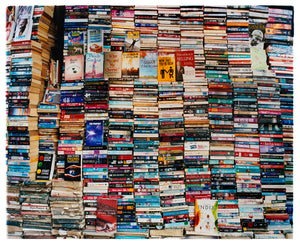 Book pile street photograph from Richard Heeps' India series.