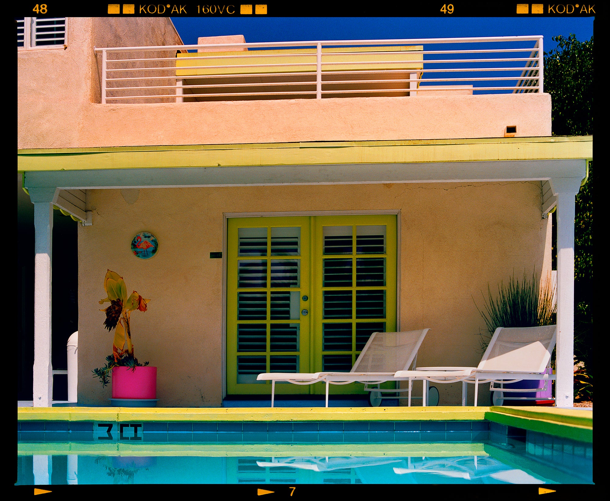 Photograph by Richard Heeps. Palm Springs Pool Side II showcases classic mid-century Palm Springs California architecture. Cool blue skies and pool with accents of pink and almost neon yellow. 