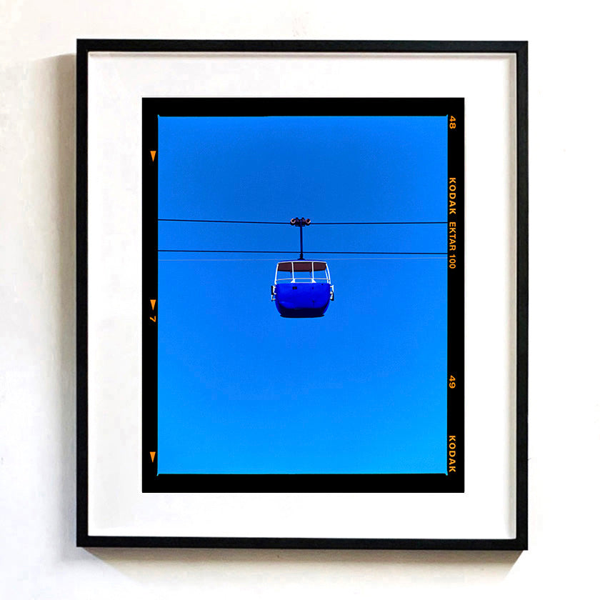 Recently sold Richard Heeps arwork framed photograph of a cable car against a blue sky with Kodak film border.