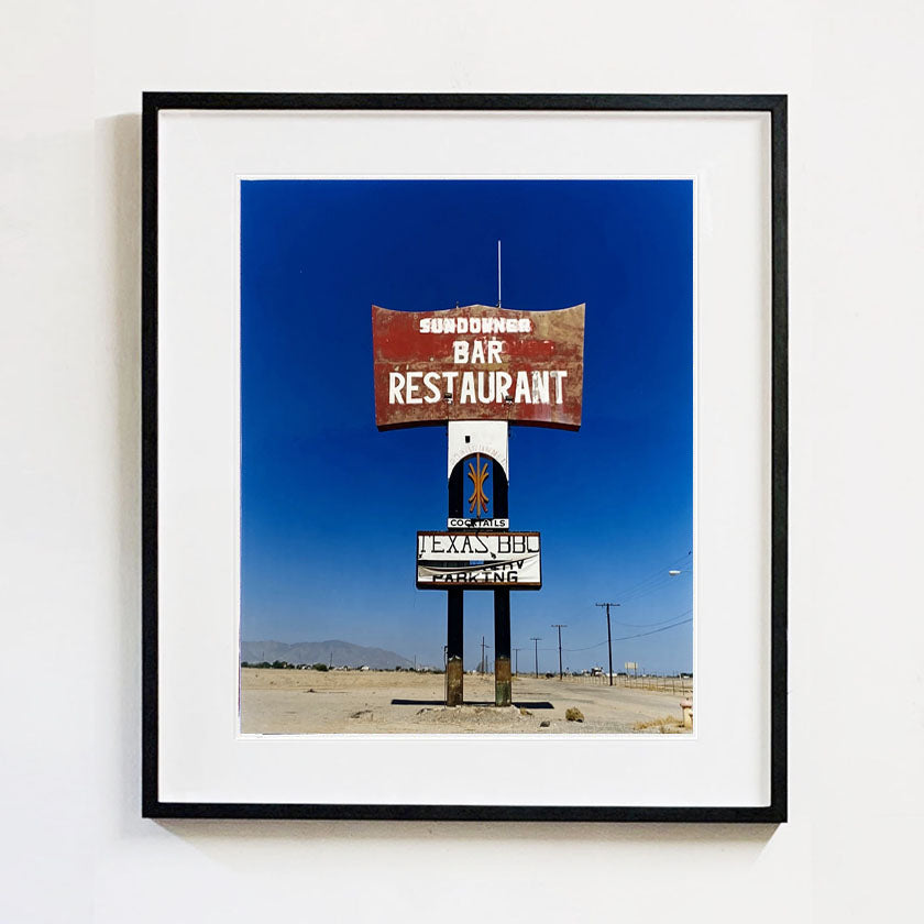Recently sold artwork Sundowner Texas BBQ restaurant sign in the Salton Sea California Desert photograph by Richard Heeps.