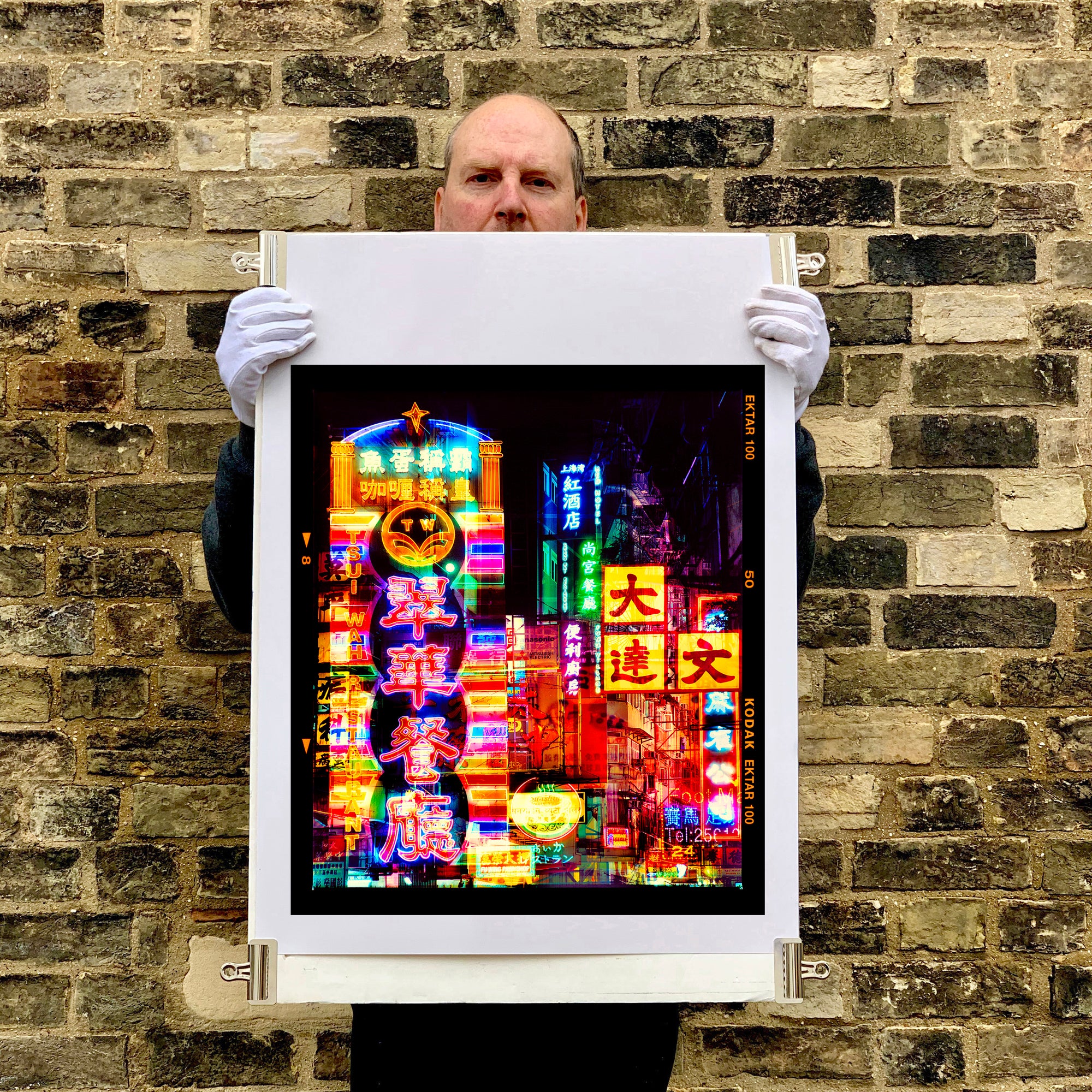 Richard Heeps holding Lights of Mong Kok Hong Kong print.