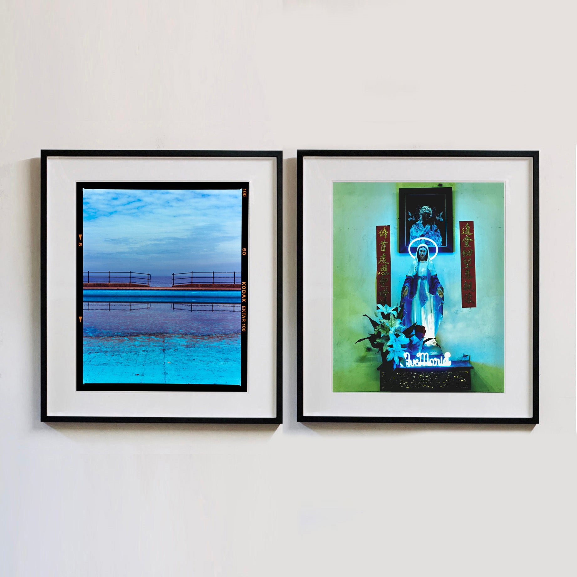 Two photographs by Richard Heeps. The photograph on the left hand side depicts the blue bay at Llandudno, cut across the middle with path and railings with a gap right in the middle. The photograph on the right hand side is a neon lit Virgin Mary, with the words "Ave Maria" lit in Neon at the statues feet, the photograph is in a green and blue toned view.