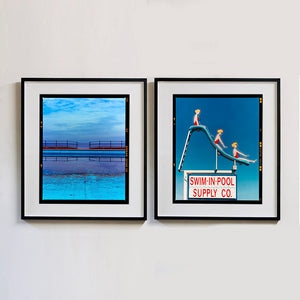 Two photographs by Richard Heeps. The photograph on the left hand side depicts the blue bay at Llandudno, cut across the middle with path and railings with a gap right in the middle. The photograph on the right hand side is a metal neon sign showing three women with blonde hair and red swimsuits at different stages down a swimming pool slide. At the bottom of the sign is written SWIM-IN-POOL SUPPLY CO