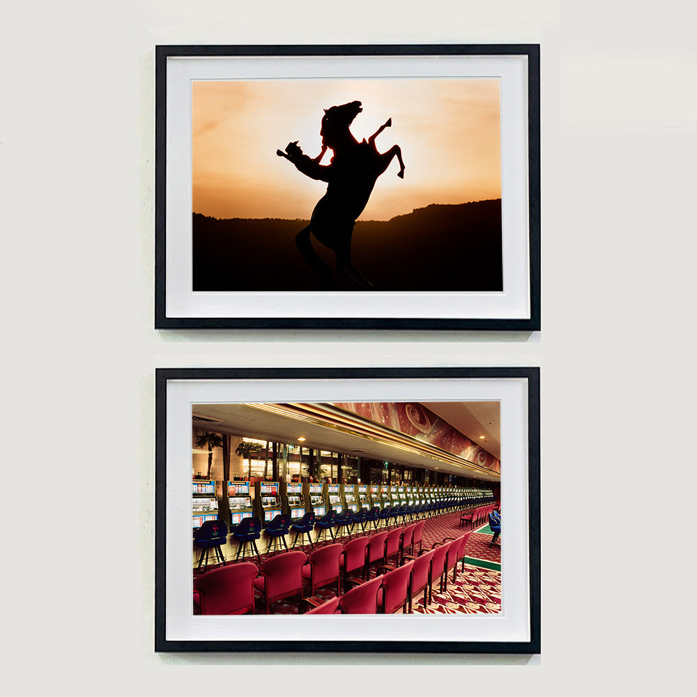 Two photographs by Richard Heeps. The one on top shows a sunset and in the middle of the photograph is the silhouette of a statue of a cowboy on his bucking horse with one arm on the reins and the other held high. The bottom photograph is some retro Las Vegas slot machines in a row.