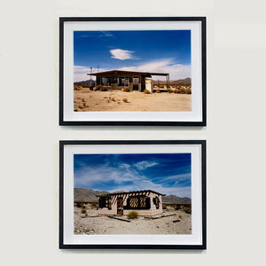 Two photographs by Richard Heeps. The top photograph depicts an abandoned building sitting alone in a desert, tumble weed on the ground and hills in the background. A blue sky with white clouds. The bottom photograph is a similar one with another abandoned building sitting in the desert with a blue Californian sky behind. 