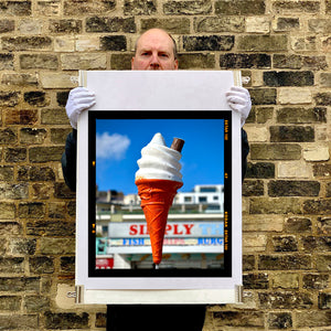 Richard Heeps holding Simply the Best Brighton ice cream cone print