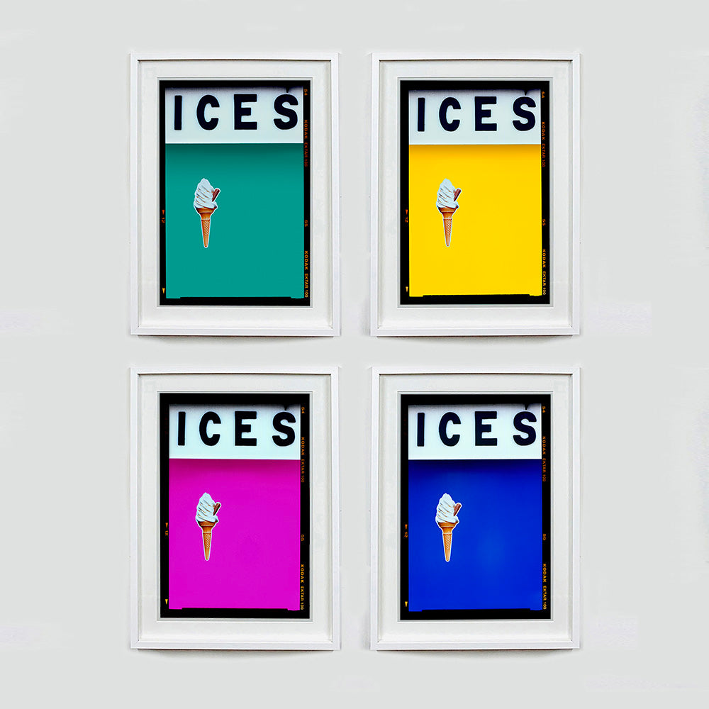 Set of four (2x2) white framed photographs by Richard Heeps.  Four identical photographs (apart from the block colour), at the top black letters spell out ICES and below is depicted a 99 icecream cone sitting left of centre set against, in turn, a Turquoise Teal, Yellow, Pink and Blue coloured background.  