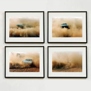 Four black framed photographs by Richard Heeps. The four photographs are of a light blue Buick car moving and slightly obscured by the dust clouds which it has created. The car is sideways on in the first photograph, coming towards the camera in the second, heading away in the third and can hardly be seen in the fourth photograph.