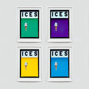 Set of four (2x2) white framed photographs by Richard Heeps.  Four identical photographs (apart from the block colour), at the top black letters spell out ICES and below is depicted a 99 icecream cone sitting left of centre set against, in turn, a viridan green, purple, sherbert yellow and sky blue oloured background.  