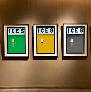 Set of three photographs by Richard Heeps.  Three identical photographs (apart from the block colour), at the top black letters spell out ICES and below is depicted a 99 icecream cone sitting left of centre set against, in turn, a green, mustard and grey coloured background.  