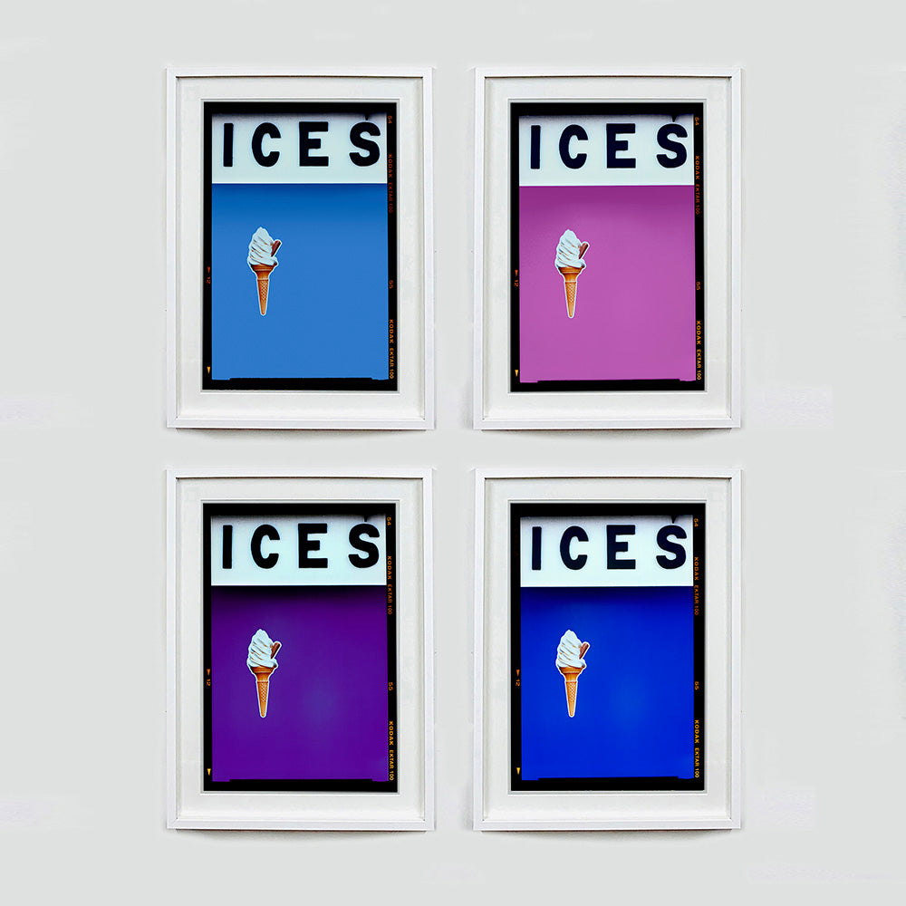 Set of four (2x2) white framed photographs by Richard Heeps.  Four identical photographs (apart from the block colour), at the top black letters spell out ICES and below is depicted a 99 icecream cone sitting left of centre set against, in turn, a baby blue, plum, purple and blue coloured background.  