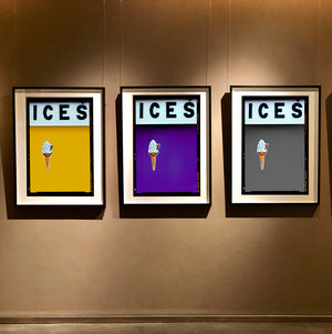 Set of three photographs by Richard Heeps.  Three identical photographs (apart from the block colour), at the top black letters spell out ICES and below is depicted a 99 icecream cone sitting left of centre set against, in turn, a mustard yellow, purple and grey coloured background.  