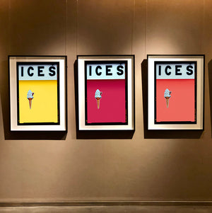 Set of three photographs by Richard Heeps.  Three identical photographs (apart from the block colour), at the top black letters spell out ICES and below is depicted a 99 icecream cone sitting left of centre set against, in turn, a sherbet yellow, raspberry and melondrama coloured background.  