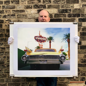 Photograph held by photographer Richard Heeps.  The back end of the classic American car with a number place DREAM01 sits underneath the STARDUST casino sign.