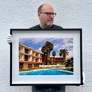 Richard Heeps holding La Concha Motel Pool at Day, mid-century architecture photograph framed in black.