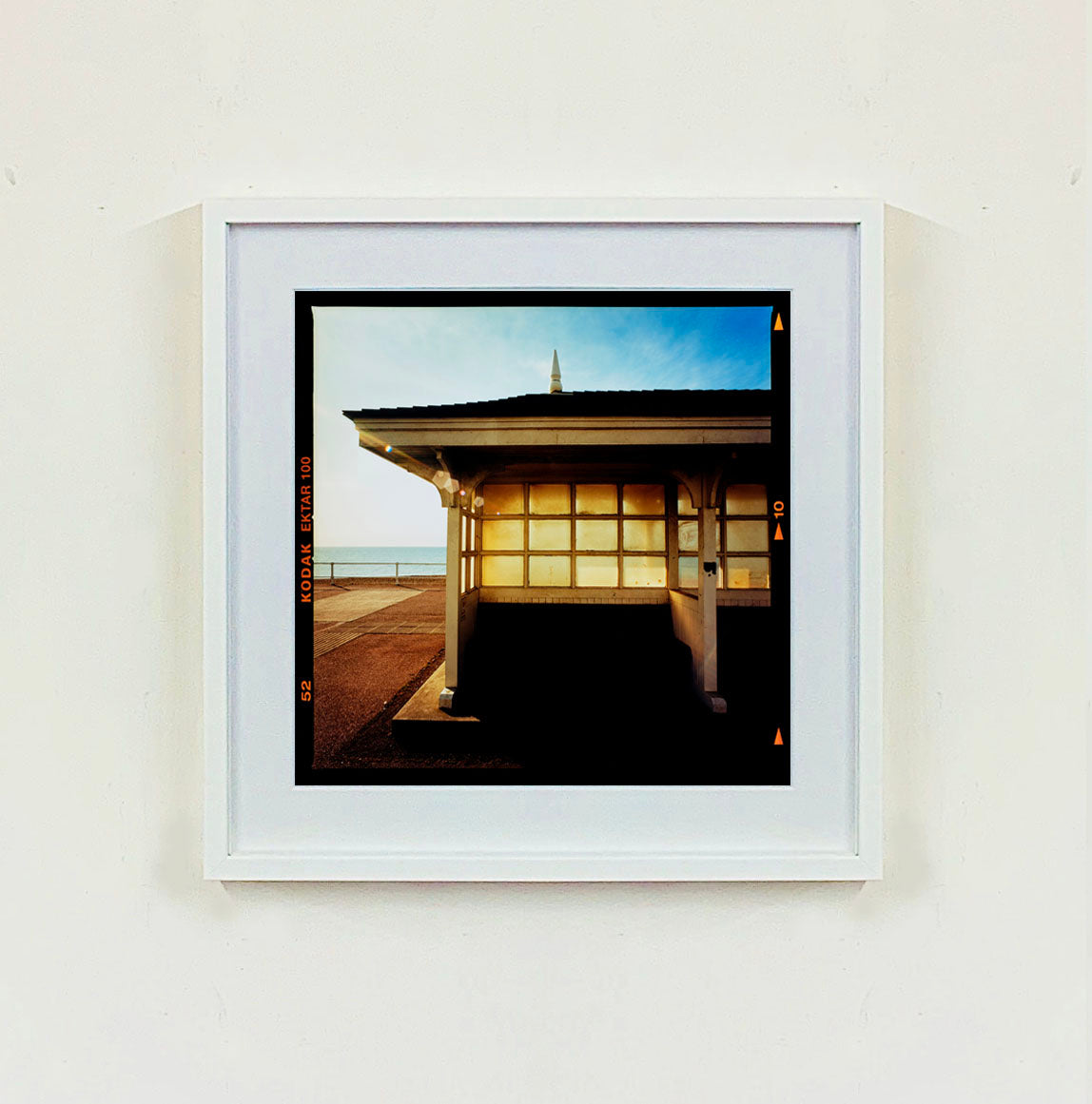 Seafront Shelters, British seaside architecture photographs by Richard Heeps print framed in white.