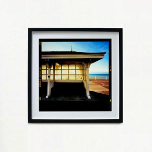 Seafront Shelter, British seaside architecture photograph by Richard Heeps print in a black frame.