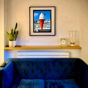 Ice cream cone on Brighton Beach Kodak photograph by Richard Heeps framed in black on the wall