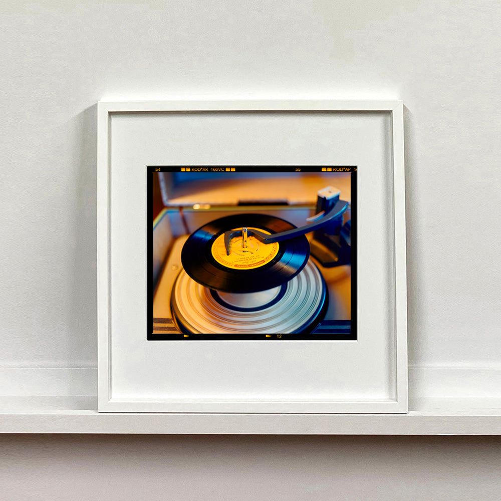 Vintage record player interior photograph from Richard Heeps Dream in Colour series mounted square in a white frame.