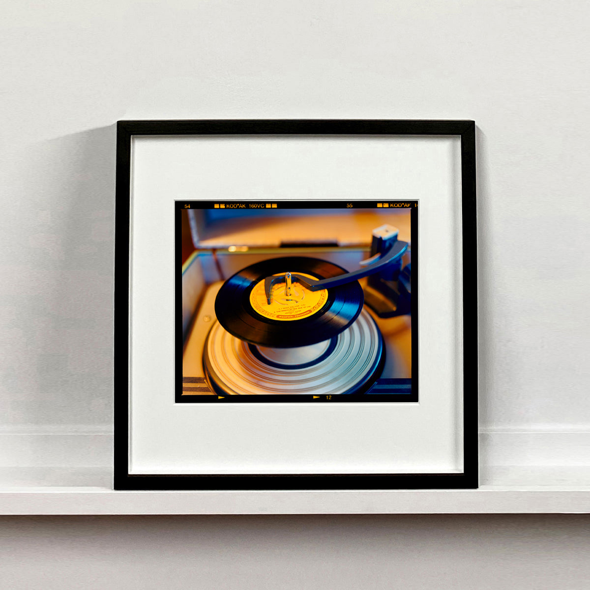 Vintage record player interior photograph from Richard Heeps Dream in Colour series mounted square in a black frame.