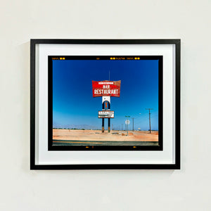 Sundowner Landscape Salton Sea California roadside America photograph by Richard Heeps framed in black.