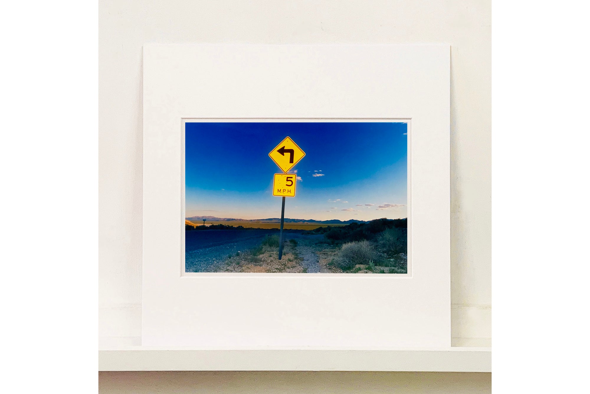 Part of Richard Heeps' 'Dream in Colour' Series, this beautiful picture taken at dusk captures the sunset in the valley.  It was photographed in what was once a goldmine, now a ghost town. The 5MPH sign seems so cautious, but on closer inspection you see that it is peppered with bullet holes, serving as a reminder of its Western past. 