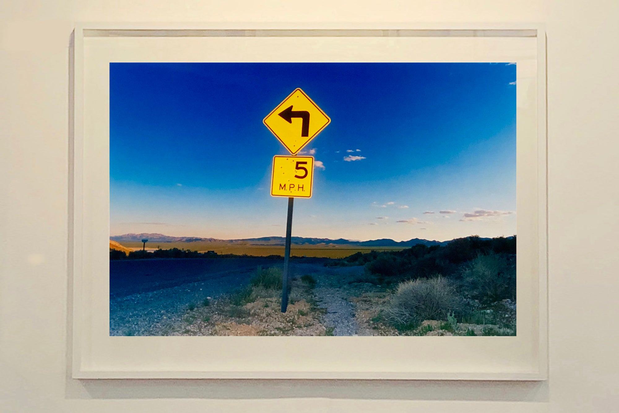 Part of Richard Heeps' 'Dream in Colour' Series, this beautiful picture taken at dusk captures the sunset in the valley.  It was photographed in what was once a goldmine, now a ghost town. The 5MPH sign seems so cautious, but on closer inspection you see that it is peppered with bullet holes, serving as a reminder of its Western past. 