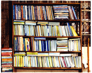 street photography of multi-color books in a book case